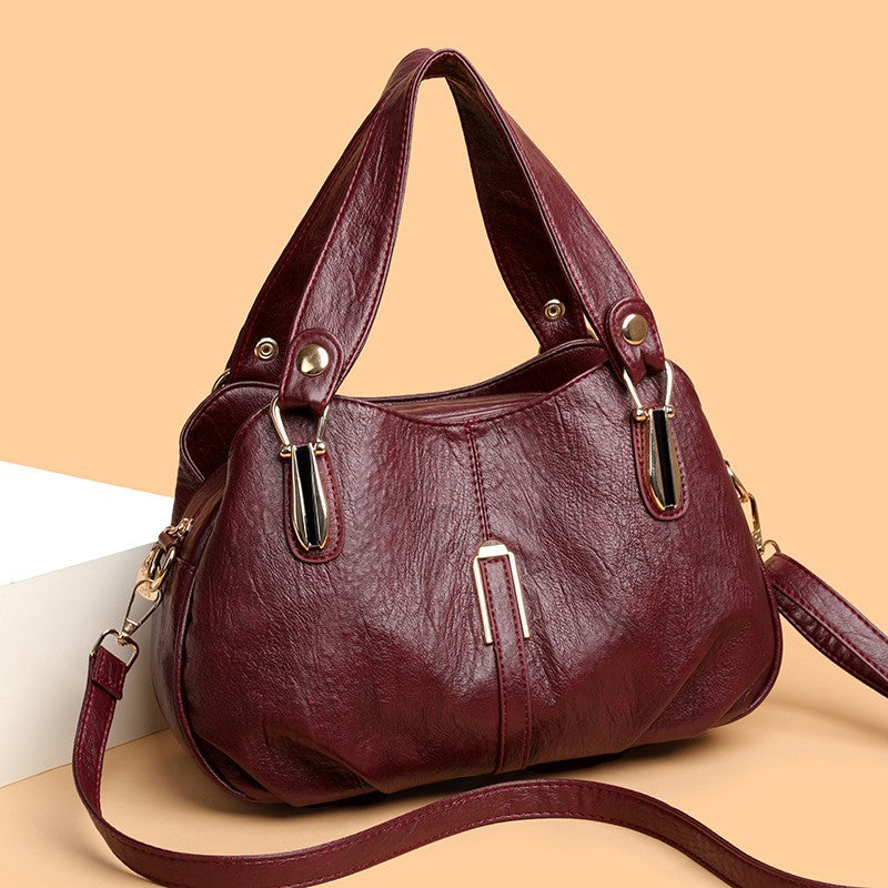 Solid-color multi-pocket handbag