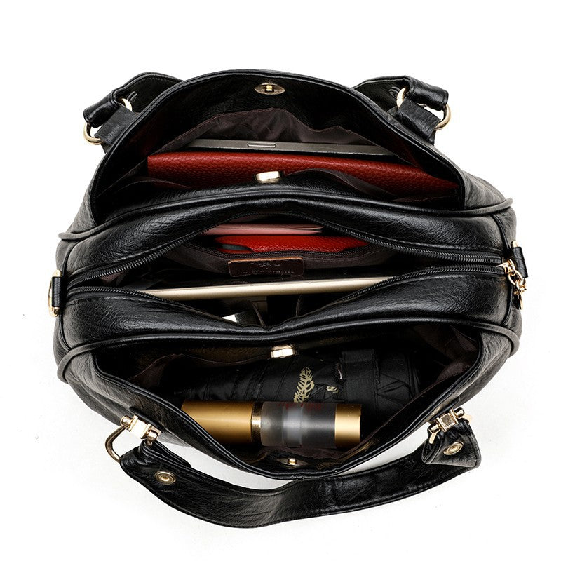 Solid-color multi-pocket handbag
