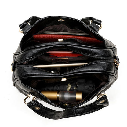 Solid-color multi-pocket handbag